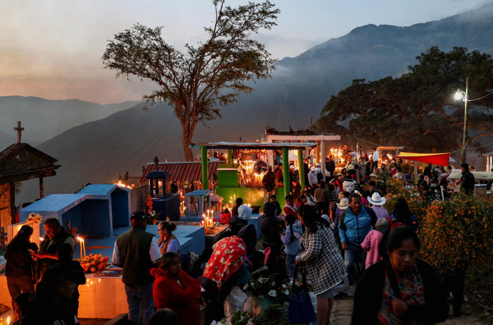 People gather at a cemetery to visit the graves of their loved ones during the Day of the Dead festivities, in Mazatlan Villa de Flores, Mexico, Nov. 2, 2025. The traditional celebration honors children on All Saints' Day, Nov. 1, and adults on All Souls' Day, Nov. 2. (OSV News/Reuters/Jorge Luis Plata)