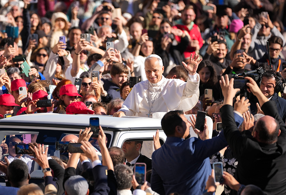 Pope Leo XIV greets visitors and pilgrims from the popemobile as he rides around St. Peter's Square at the Vatican before his weekly general audience Nov. 5, 2025. (CNS/Lola Gomez)