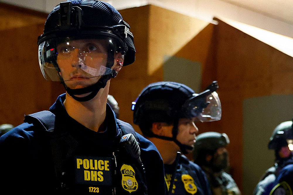 Federal law enforcement officers confront protesters outside Oregon's Immigration and Customs Enforcement (ICE) facility in Portland, Oregon, Oct. 3, 2025. (OSV News/Reuters/John Rudoff)