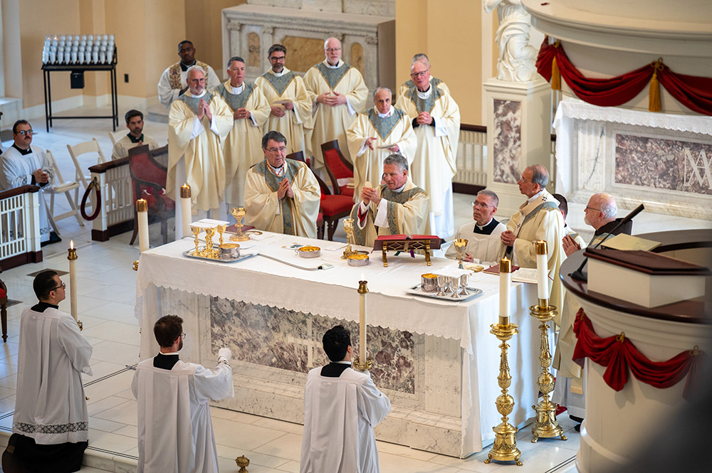 Standing at the altar from left, Cardinal Christophe Pierre, apostolic nuncio to the United States; Archbishop Timothy Broglio of the U.S. Archdiocese for the Military Services; and Baltimore Archbishop William Lori concelebrate Mass at the Basilica of the National Shrine of the Assumption of the Blessed Virgin Mary in Baltimore Nov. 10, 2025, to open the fall plenary assembly of the U.S. Conference of Catholic Bishops. (OSV News/Catholic Review/Kevin J. Parks)