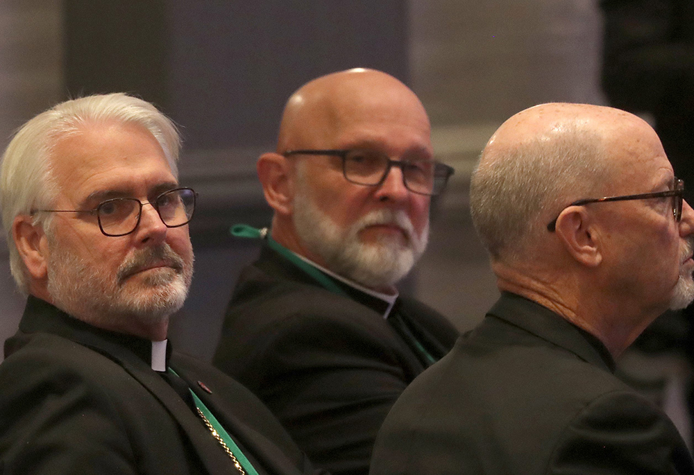 Archbishop Paul Coakley of Oklahoma City, left, looks on moments after being elected president of the U.S. Conference of Catholic Bishops during a Nov. 11, 2025, session of the fall general assembly of the U.S. bishops' in Baltimore. His three-year term begins at the close of the Nov. 11-13 plenary. (OSV News/Bob Roller)