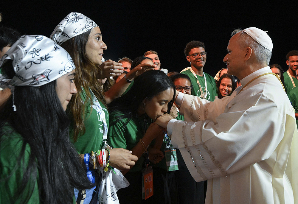 Pope Leo XIV greets young people after presiding over a prayer vigil with hundreds of thousands of young people in Rome's Tor Vergata neighborhood Aug. 2, 2025. Pope Leo will digitally address and dialogue on Nov. 21 with attendees at the 2025 National Catholic Youth Conference in Indianapolis, which is expected to draw about 15,000 young people ages 14-18. (CNS/Vatican Media)