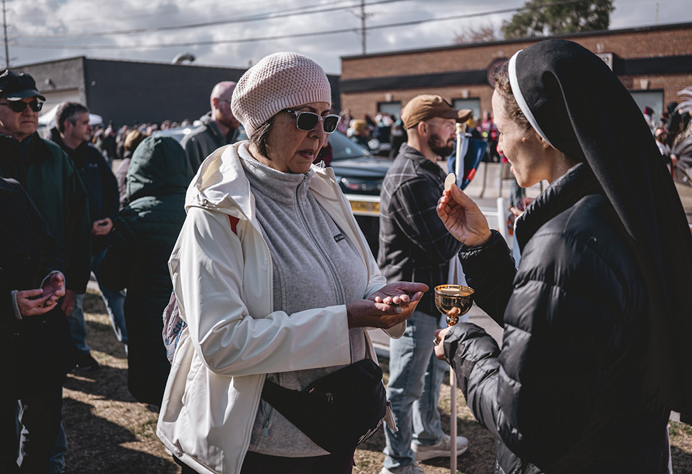 Catholics receive Communion outside the ICE Broadview facility during an outdoor Mass, in Broadview, Illinois, outside Chicago Nov. 1. (Courtesy of Coalition for Spiritual and Public Leadership)