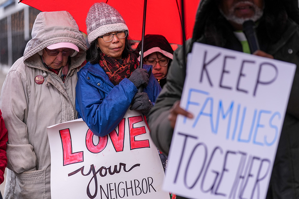 Mercy Sr. May Cronin, left, and Missionary Servant of the Most Blessed Trinity Sr. Christine Ma participate in a prayer vigil near the U.S. Immigration and Customs Enforcement Field Office Nov. 19, 2025, in Philadelphia. (AP/Matt Slocum)