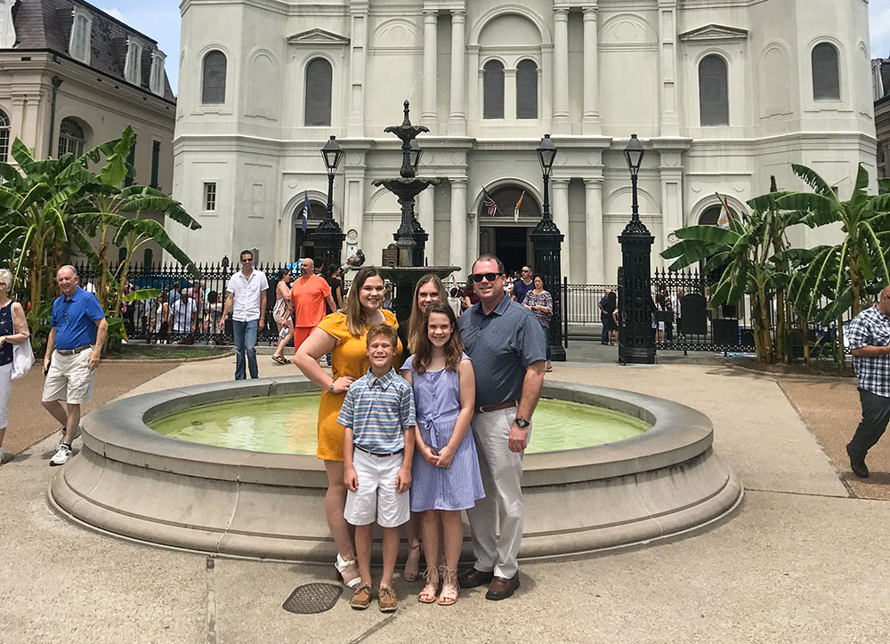 James Adams and his children pose for a photo outside St. Louis Cathedral in New Orleans after Sunday Mass in April 2019. (Courtesy of James Adams)