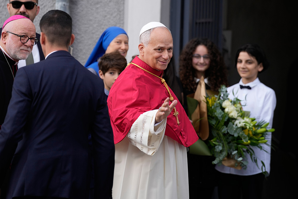 Pope Leo XIV waves to the people as he arrives at the Cathedral of the Holy Spirit in Istanbul Nov. 28, 2025, during his first foreign trip. (AP/Emrah Gurel)