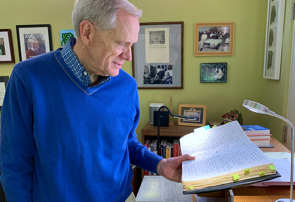 The Rev. Wesley Granberg-Michaelson looks at the daily journal he kept for over 50 years. (Courtesy of Wesley Granberg-Michaelson)