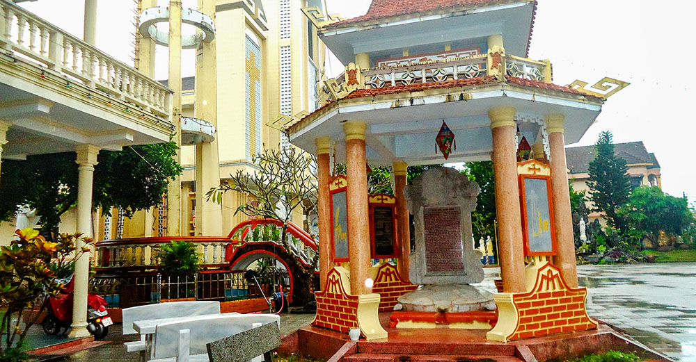 This memorial stele house honors Martha Le Thi Bao, the first person in An Bang village to be baptized, in 1894. Located beside Sts. Peter and Paul Church, the Asian-style shrine features a stone stele resting on the back of a turtle, symbolizing wisdom and longevity. (Joachim Pham)