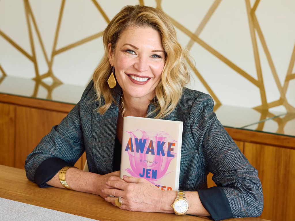 Author Jen Hatmaker holds her new book, "Awake." (RNS/Courtesy photo)