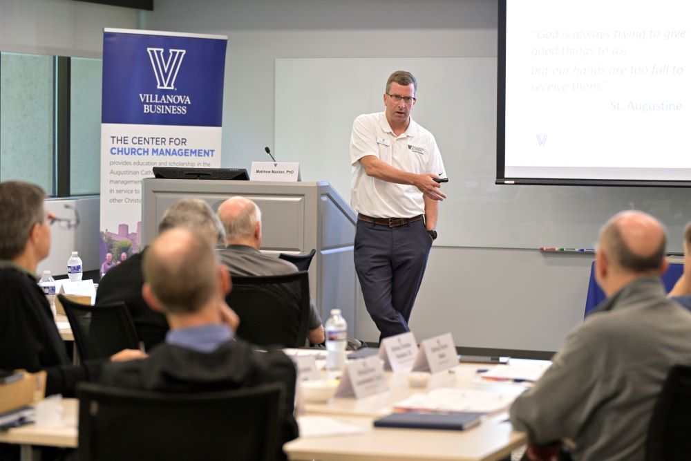 Matthew Manion, the Grenon Family Faculty Director of the Villanova Center for Church Management who directed the Villanova bishops training, teaches a management class during the summer training for U.S. bishops at Villanova University July 23.