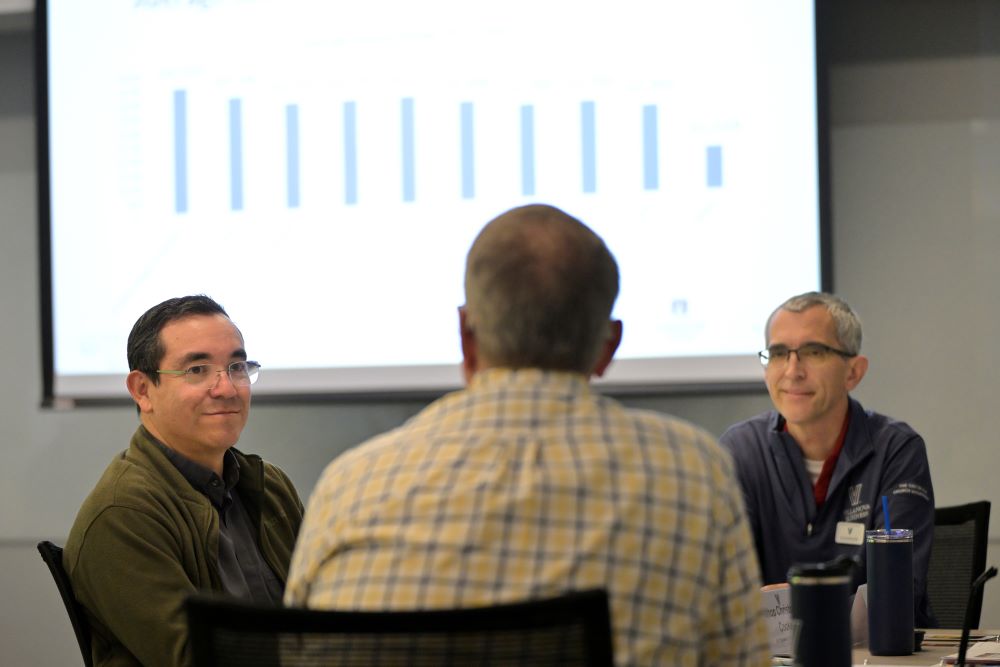 Auxiliary Bishop of San Diego Felipe Pulido, Auxiliary Bishop of Philadelphia Christopher Cooke and Bishop Mike Martin of Charlotte discuss a case study together during the summer training for U.S. bishops at Villanova University July 23.