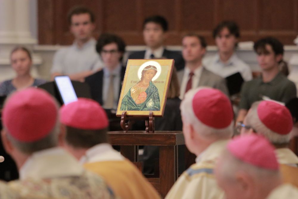 Some of the bishops in a training program at Villanova University and Villanova students from the Villanova Pastoral Musicians attend Mass together July 22.