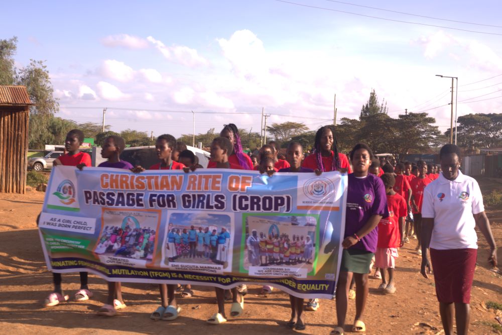 Girls rescued from female genital cutting march through the streets of Suguta Marmar in northern Kenya to educate the community about the harms of the practice.