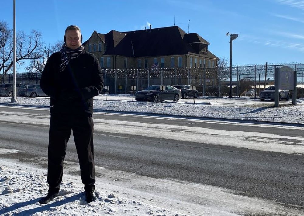 Bishop Ronald A. Hicks of Joliet, Ill., stands across the street from the Joliet Treatment Center, Dec. 25, 2022, where he celebrated Christmas Mass for inmates. 