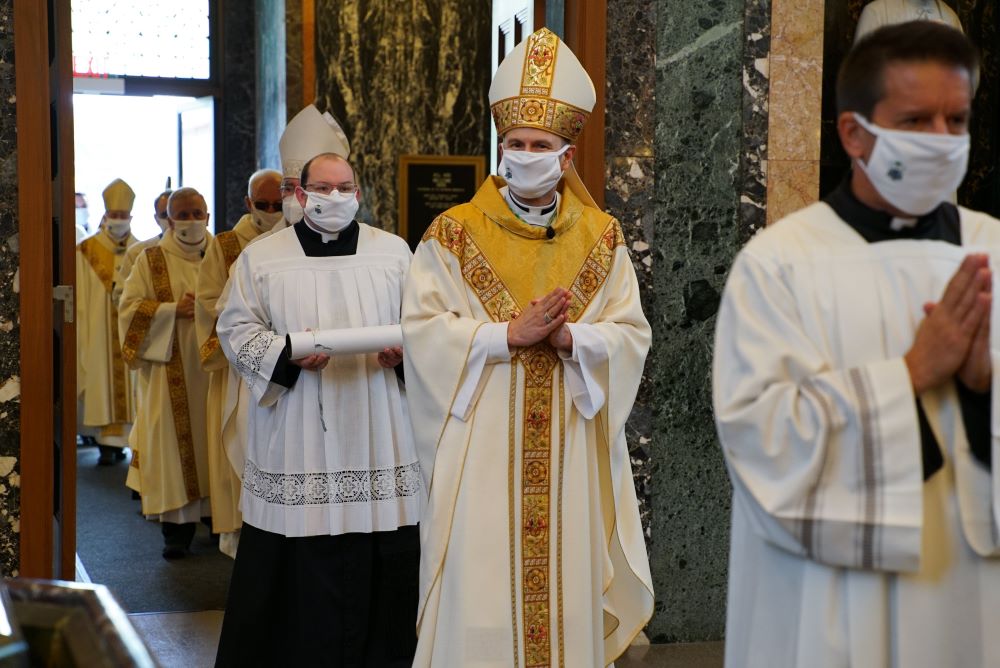 Bishop Ronald A. Hicks enters the Cathedral of St. Raymond Nonnatus in Joliet, Ill., just before the start of the Sept. 29, 2020, Mass installing him as the sixth bishop of the Diocese of Joliet. 