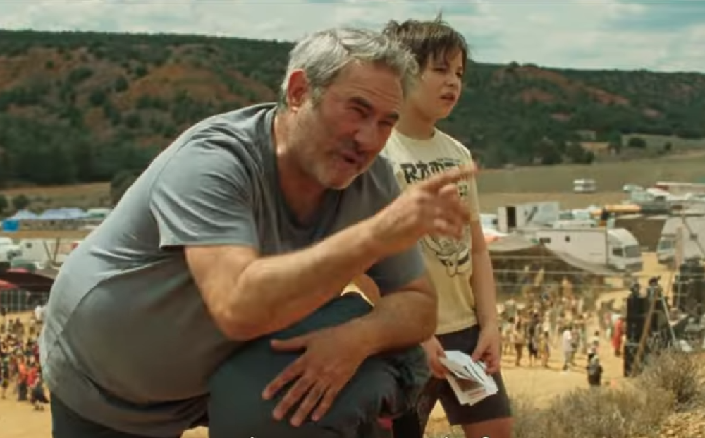 Movie still shows Sergi López and Bruno Nuñez Arjona in "Sirāt." 