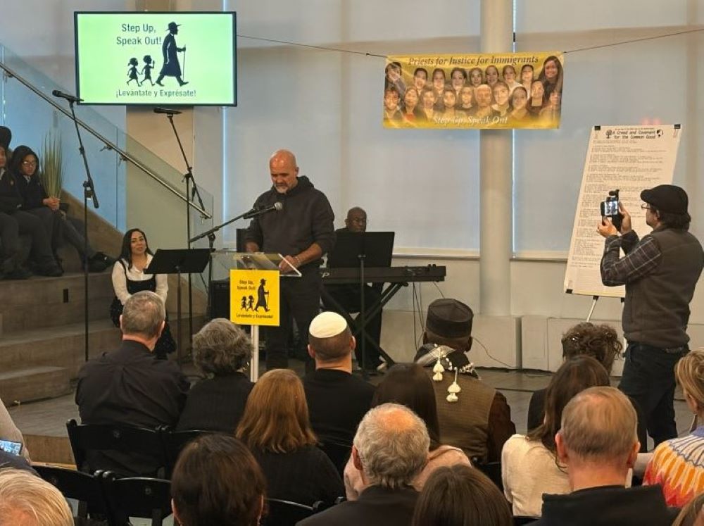 Fr. Gary Graf reads in front of group. 