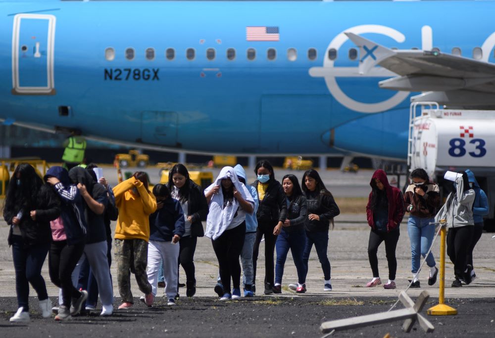 Guatemalan migrants arrive at La Aurora Air Base on a deportation flight from the United States, in Guatemala City, Feb. 18. (OSV News/Reuters/Cristina Chiquin)