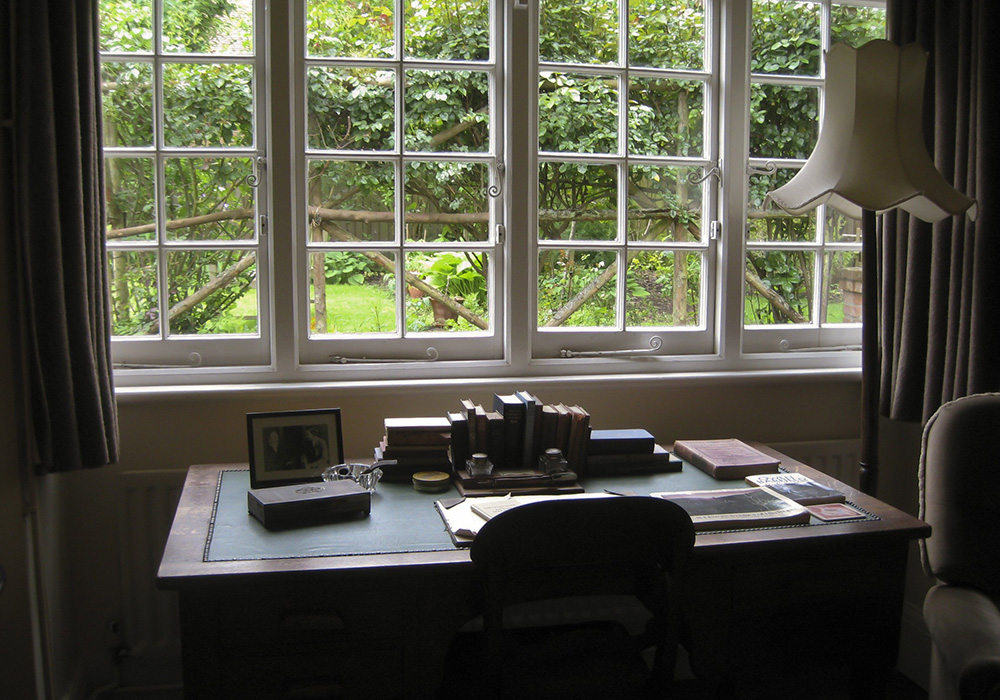 A desk overlooks the garden in The Kilns in Oxford, England, where C.S. Lewis penned his Christian stories, including "The Chronicles of Narnia." (CNS photo)
