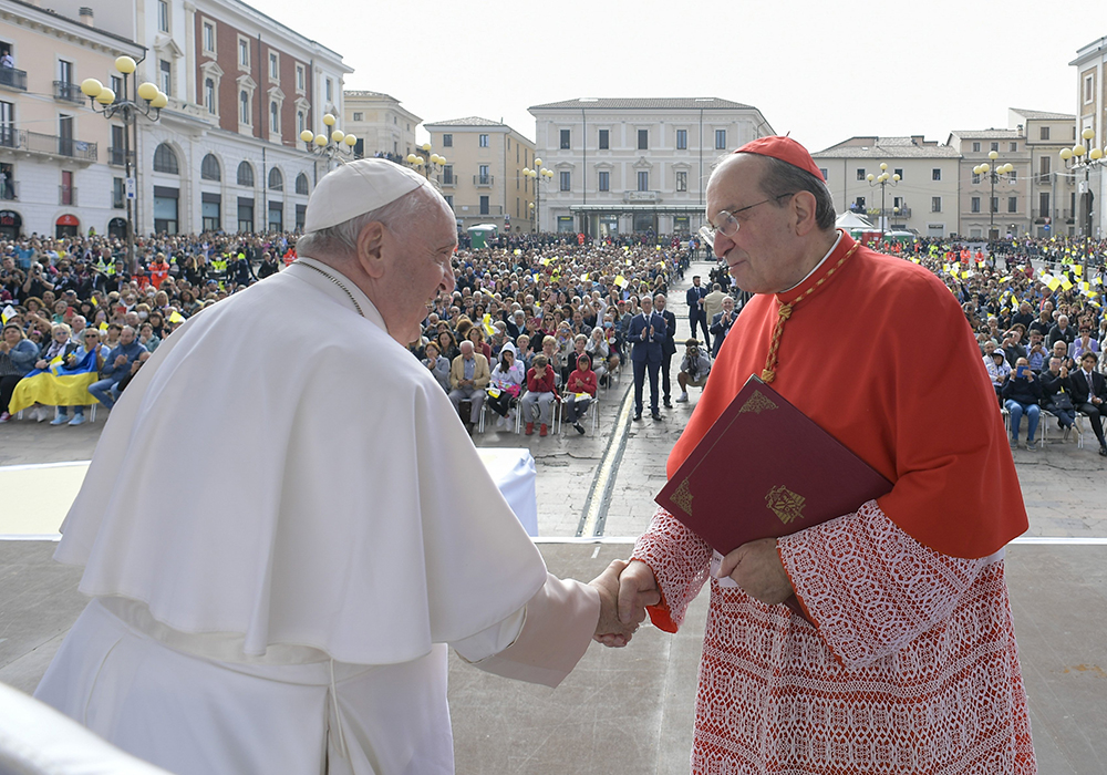 Pope Francis greets Cardinal Giuseppe Petrocchi of L'Aquila during an encounter in Piazza Duomo in L'Aquila, Italy, Aug. 28, 2022. (CNS/Vatican Media)