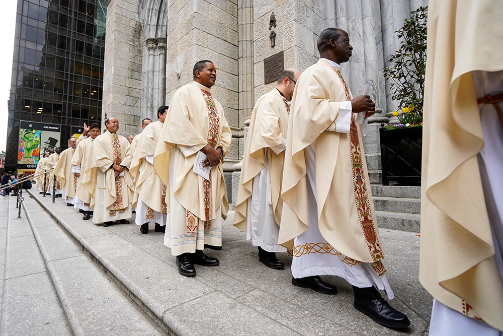 Priests process into St. Patrick's Cathedral in New York City to concelebrate the chrism Mass April 15, 2025. (OSV News photo/Gregory A. Shemitz)