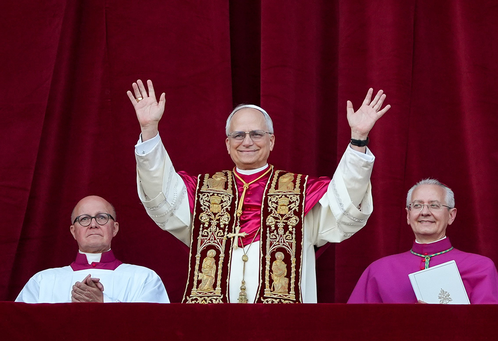 Pope Leo XIV, the former Cardinal Robert F. Prevost, waves to the crowds in St. Peter's Square at the Vatican after his election as pope May 8, 2025. (CNS/Lola Gomez)