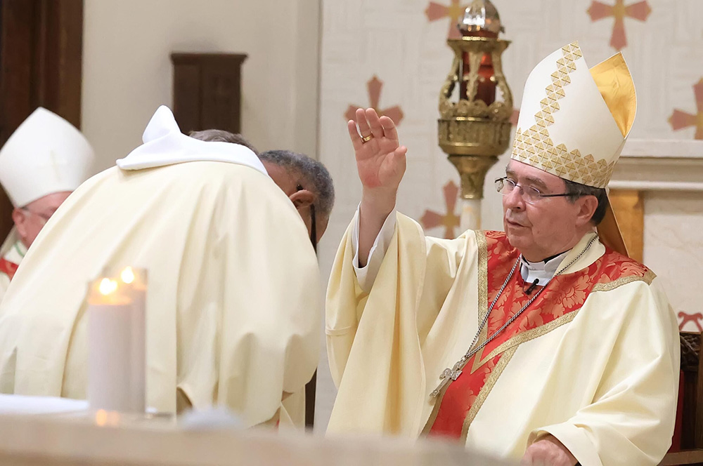 Cardinal Christophe Pierre, papal nuncio to the United States, blesses Deacon Robert Cousar before he reads the Gospel during the Raskob Foundation Family Mass at St. Joseph Church in Wilmington, Del., Sept 20, 2025. (OSV News/The Dialog/Don Blake)