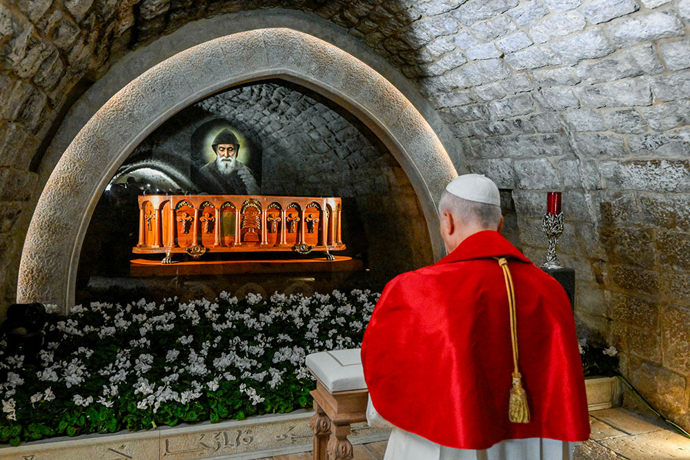 Pope Leo XIV prays in silence before the tomb of St. Charbel at the Monastery of St. Maron in Annaya, Lebanon, Dec. 1, 2025. (CNS/Vatican Media)