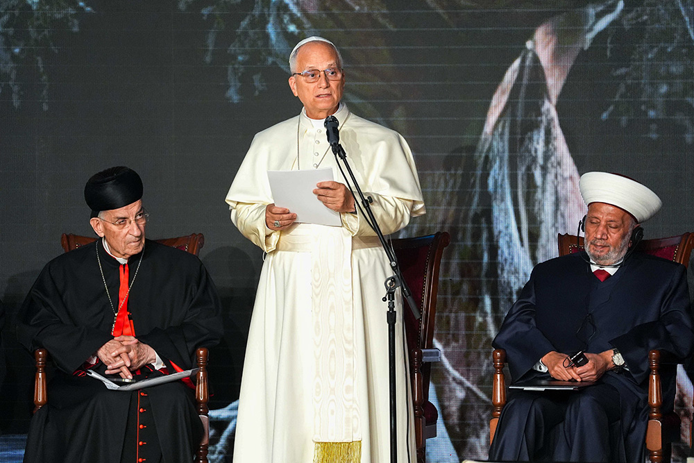 Pope Leo XIV delivers a reflection during an ecumenical and interreligious meeting in Martyrs' Square in Beirut Dec. 1, 2025. Seated behind him are Cardinal Bechara Rai, patriarch of the Maronite Catholic Church, left, and Sheikh Abdul Latif Derian, the grand mufti of Lebanon. (CNS/Lola Gomez)