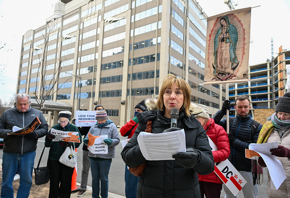 Michele Dunne, a secular Franciscan who is executive director of the Franciscan Action Network, speaks during a prayer vigil outside the U.S. Customs and Immigration Enforcement headquarters in Washington Dec. 12, 2025. (OSV News/Leslie E. Kossoff)