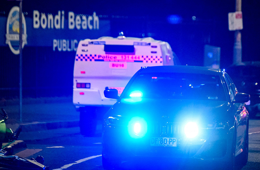 Emergency vehicles are at the scene of the mass shooting at Bondi Beach in Sydney Dec. 14, 2025. (OSV News/Reuters/Izhar Khan)