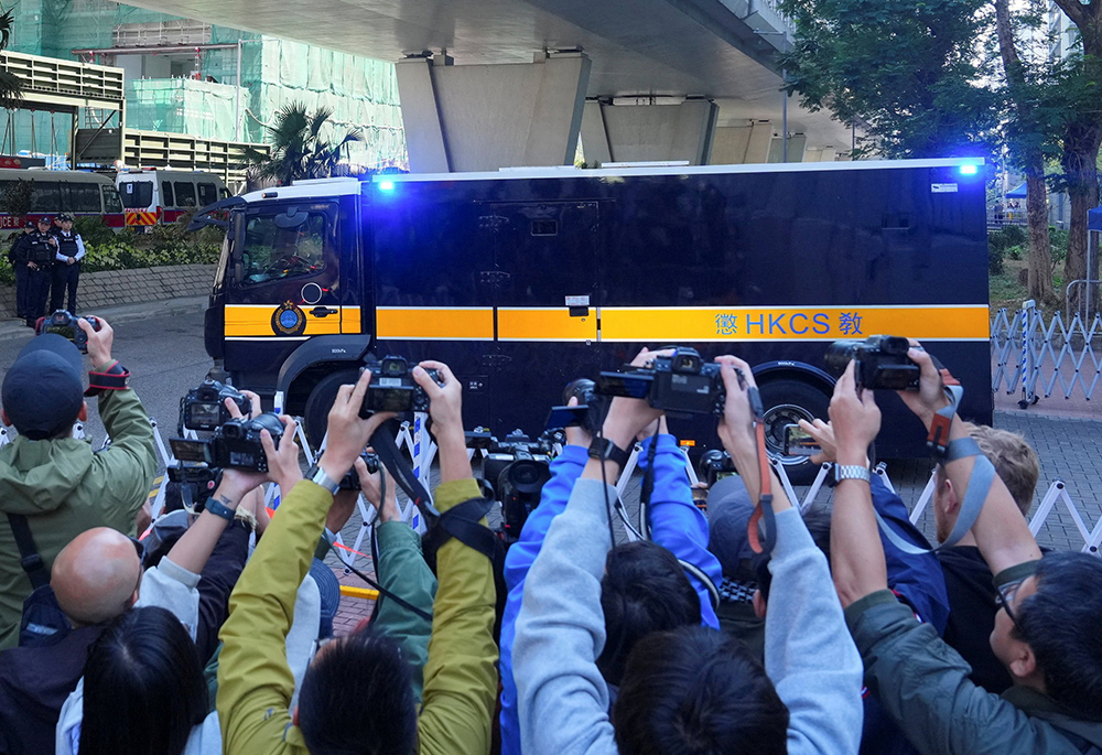 A prison van believed to be carrying Jimmy Lai, leaves the West Kowloon Magistrates' Courts building Dec. 15, 2025, after the verdict in the trial of Lai, a prominent Hong Kong Catholic, philanthropist and media mogul. Three government-vetted judges found Lai, 78, guilty of conspiring with others to collude with foreign forces to endanger national security and conspiracy to publish seditious articles. He pleaded not guilty to all charges. (OSV News/Reuters/Lam Yik)