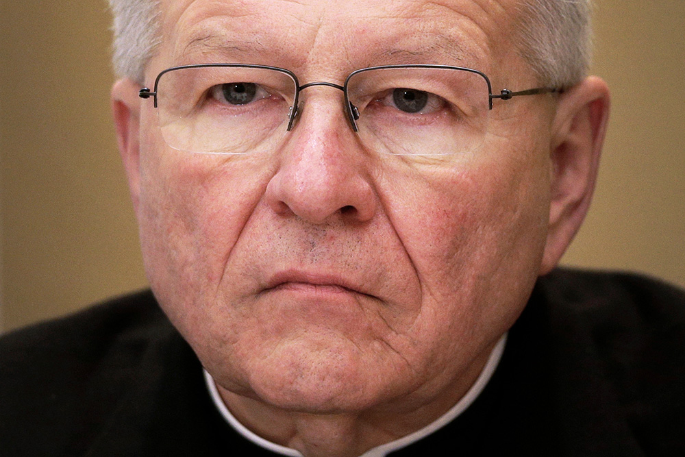 Archbishop Gregory Aymond, of New Orleans, listens during a news conference at the United States Conference of Catholic Bishops' annual fall meeting in Baltimore, Nov. 12, 2013. (AP Photo/Patrick Semansky, File)