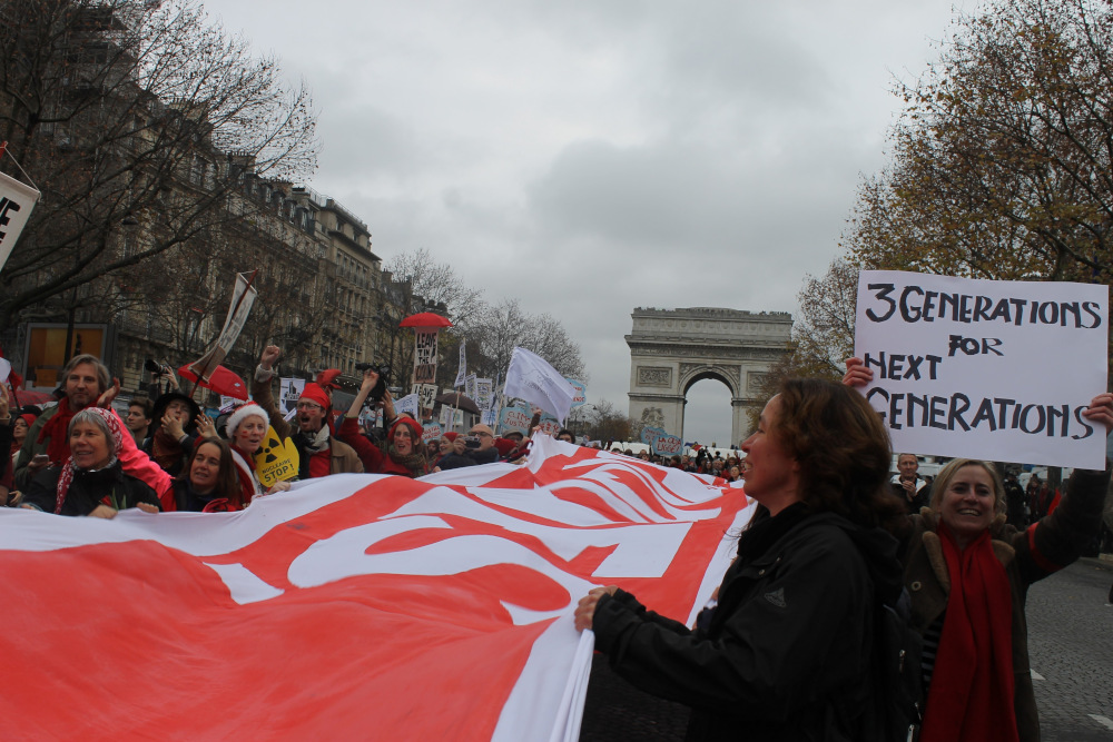 Thousands assembled along the Avenue de la Grande Armee in Paris Dec. 12 hours before 195 nations adopted the Paris Agreement, which provided a framework for global action on climate change. (NCR photos/Brian Roewe)