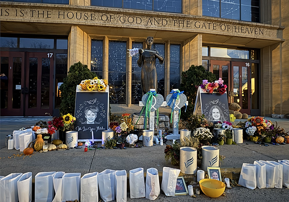 Flowers, candles, and tributes lay outside Annunciation Catholic Church in South Minneapolis for the two students that lost their lives in the Aug. 27 shooting, Fletcher Merkel and Harper Moyski. The Annunciation community has been gathering there every night at 9 p.m. to pray the rosary. (NCR photo/Camillo Barone)
