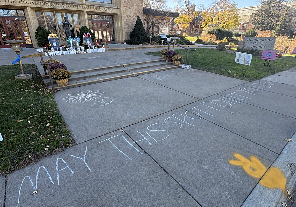 A chalk inscription outside Annunciation Catholic Church in Minneapolis that says, "May this spot point you to God," Nov. 12. (NCR photo/Camillo Barone)