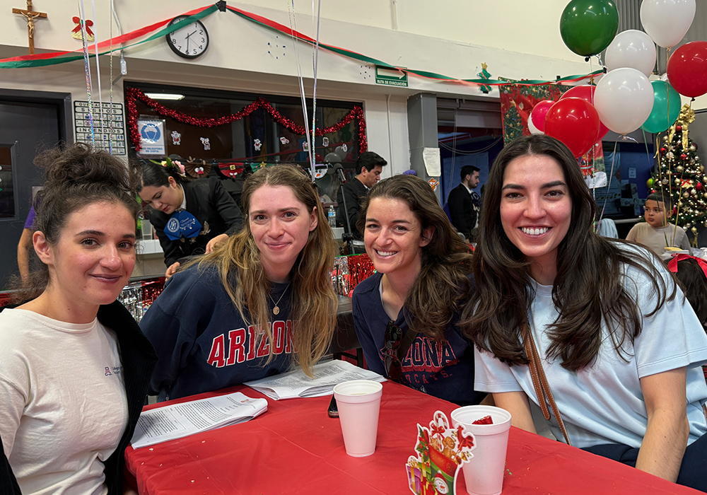 Medical students from the University of Arizona in Tucson take part in a traditional Mexican holiday celebration at the Kino Border Initiative headquarters in Nogales, Mexico, on Dec. 20. From left: Jillian Max, Isabella Steidley, Jenna Glovsky and Victoria Rubio. (Anita Snow)