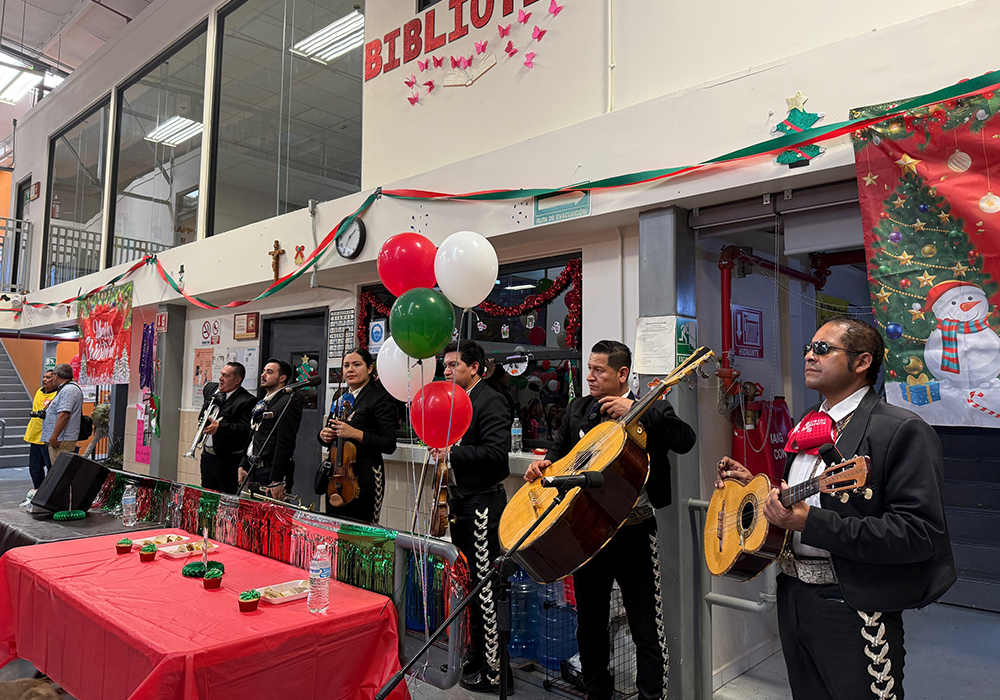 A mariachi band performs at a traditional Mexican posada celebration at the Kino Border Initiative headquarters in Nogales, Mexico, on Dec. 20. (Anita Snow)