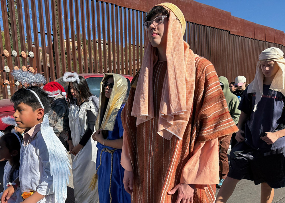 An adolescent boy portrays Joseph in a traditional posada procession in Nogales, Mexico, on Saturday, Dec. 20. (Anita Snow)