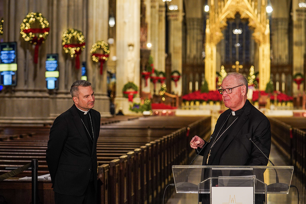 New York Cardinal Timothy Dolan, right, greets Bishop Ronald Hicks during a news conference at St. Patrick's Cathedral in New York City Dec.18, 2025. Hicks will be installed as the new archbishop of the New York Archdiocese in early February. (AP/Ryan Murphy)