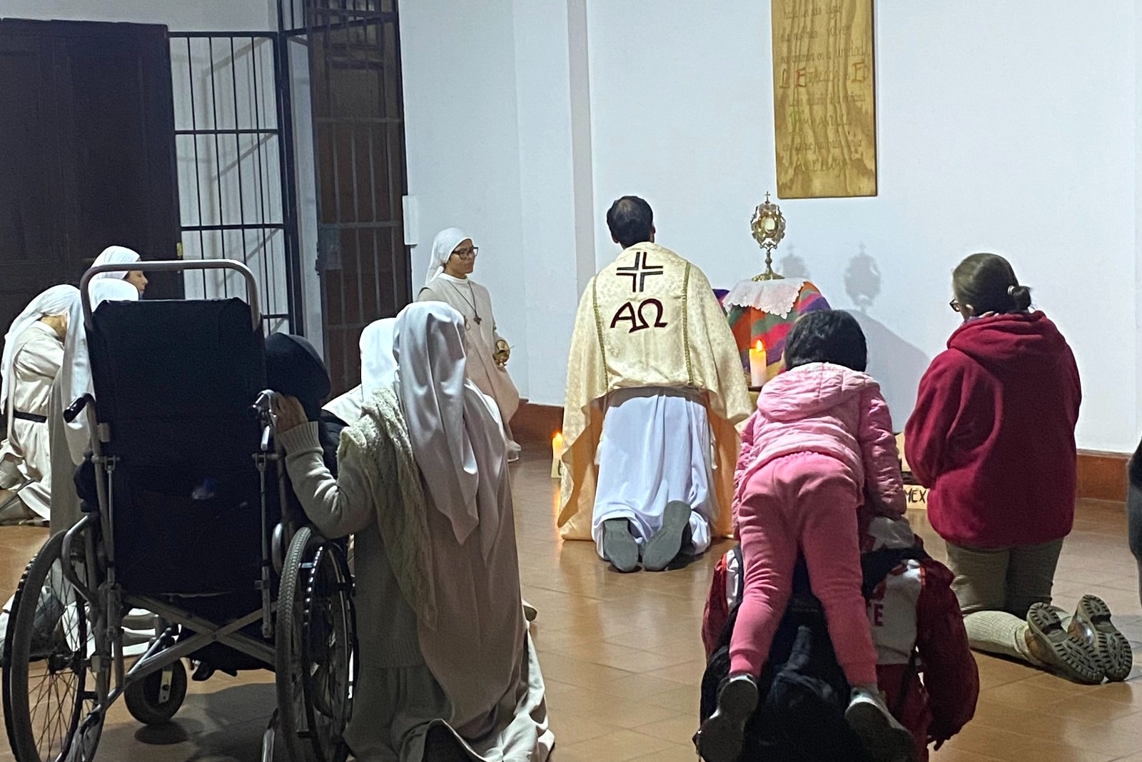 A child the author calls Hope rests on Compassion's back during adoration at the Monastery of the Incarnation in Lima, Peru, in 2025. (Courtesy of Marlene Quispe Tenorio) 