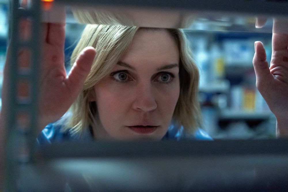 In Apple TV's "Pluribus," Rhea Seehorn plays Carol Sturka, a cranky author who is isolated after an alien virus "joins" the rest of humanity into a peaceful and content hive mind. (Apple TV)