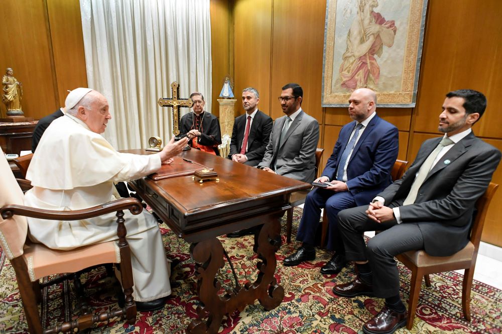 Pope Francis meets Sultan al-Jaber, the president-designate of the 2023 United Nations Climate Change Conference, known as COP28, his delegation and Cardinal Miguel Ángel Ayuso Guixot, prefect of the Dicastery for Interreligious Dialogue, at the Vatican Oct. 11, 2023. (CNS/Vatican Media)