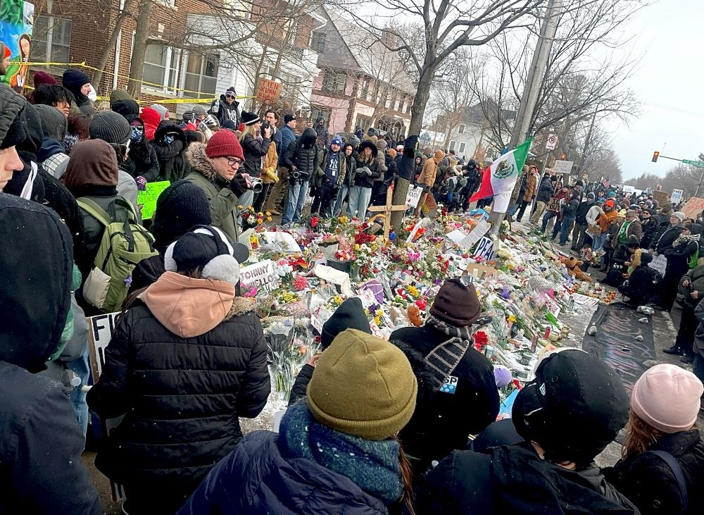 Participants in a "ICE out of Minnesota" rally Jan 10 stand at a memorial marking the site where an ICE agent shot and killed Renee Good had been shot and killed Jan. 7. Pastors in the area say church attendance is down as ICE activity takes place. (Tim Montgomery)