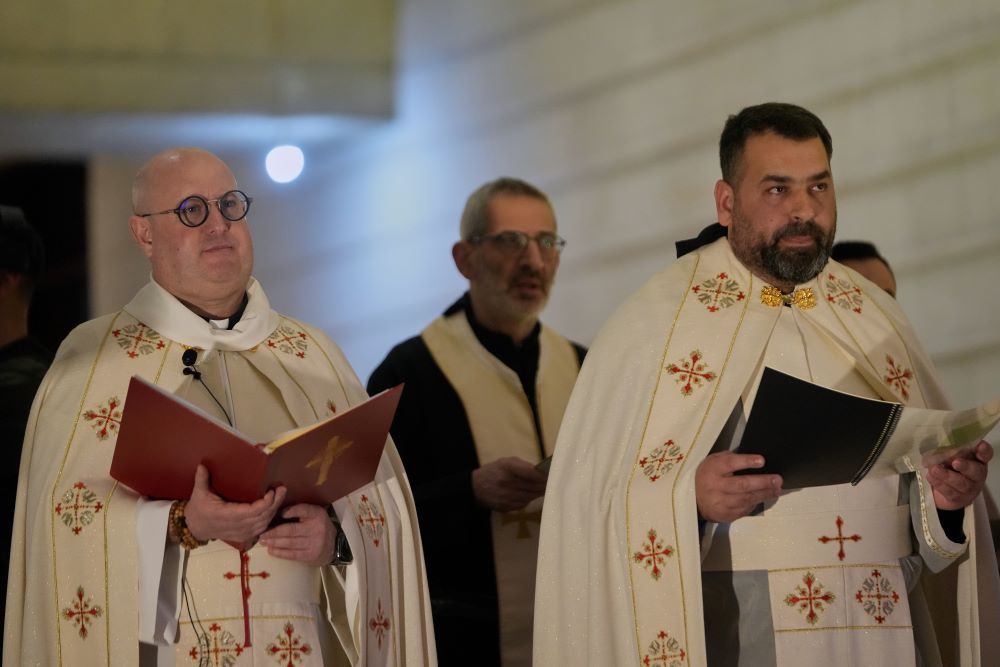 Fr. Guilherme Peixoto, left, leads a Mass ahead of his concert at the Holy Spirit University of Kaslik, Lebanon Jan. 10. A Lebanese court rejected a petition to ban his concert. (AP/Hussein Malla)
