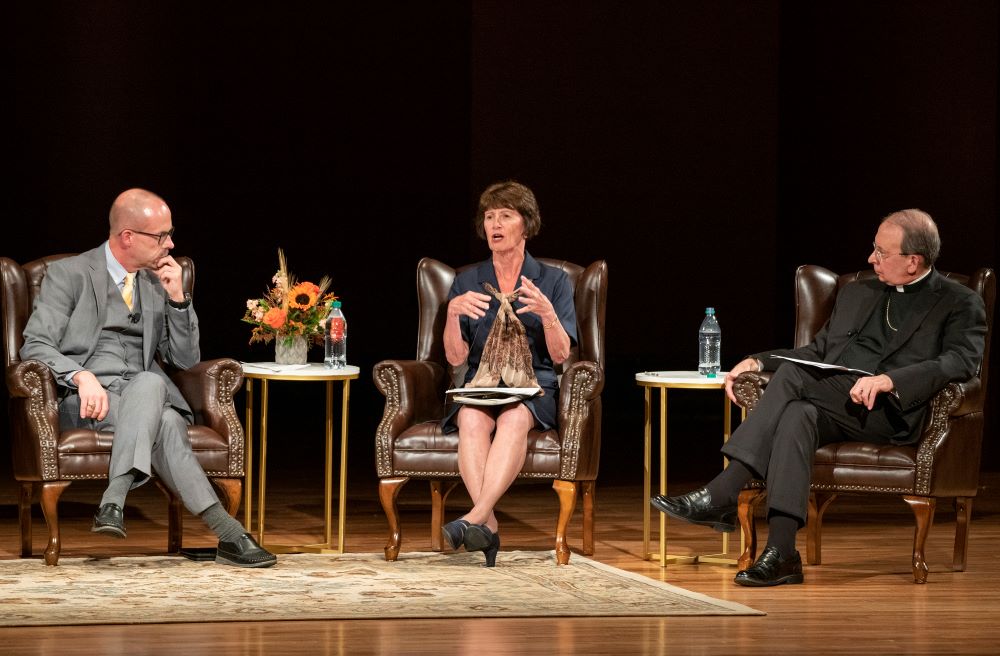John L. Allen Jr. listens to  Kathleen McChesney, former FBI executive assistant director who investigated abuse victim allegations, during a panel discussion at the University of Notre Dame in Indiana Sept. 25, 2019. Baltimore Archbishop William E. Lori is at right. (CNS/University of Notre Dame/Barbara Johnston)