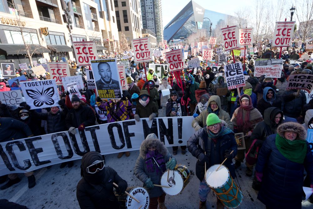 Thousands of protesters gathered Jan. 23 in downtown Minneapolis to oppose the Trump administration's aggressive immigration enforcement. Police arrested about 100 clergy demonstrating at Minneapolis-St. Paul International Airport. AP/Angelina Katsanis)