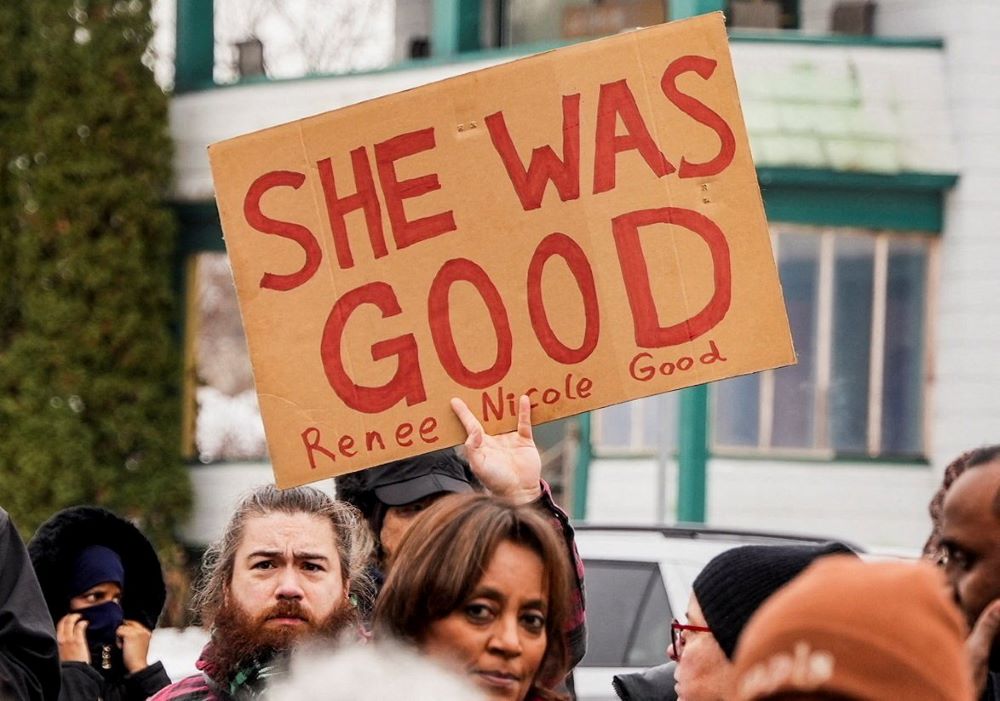A man holds up a sign as protesters gather in Minneapolis Jan. 8 at the scene of the fatal shooting of Renee Nicole Good by a U.S. Immigration and Customs Enforcement agent. Protests since the shooting have demanded that ICE leave the state of Minnesota and for the ICE agent who killed Good to be held accountable. (OSV News/Reuters/Tim Evans)