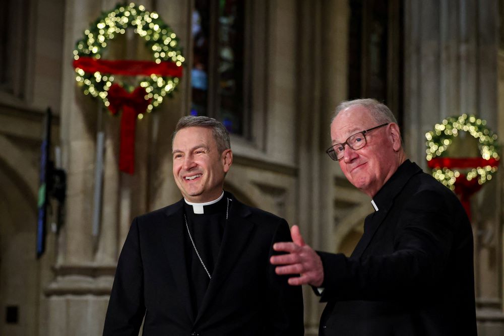Archbishop Ronald Hicks and New York Cardinal Timothy Dolan smile during a news conference at St. Patrick's Cathedral in New York City Dec. 18 after Pope Leo XIV appointed  Hicks as Dolan's successor. (OSV News/Reuters/Brendan McDermid)