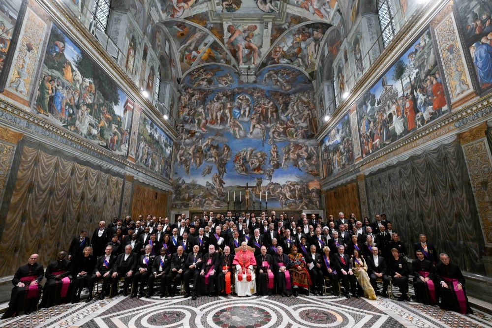 Pope Leo XIV poses for a group photo with members of the diplomatic corps accredited to the Holy See inside the Sistine Chapel at the Vatican Jan. 9, 2026. (CNS/Vatican Media)